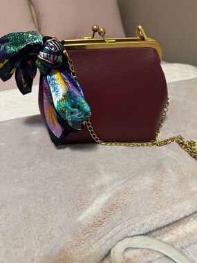 Maroon Frame-Clasp Wristlet with Gold Chain and Scarf Accent